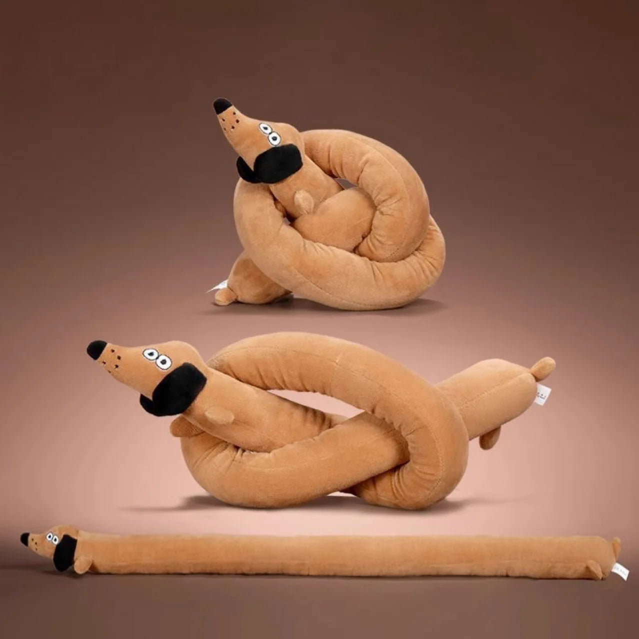 Long, thin, talking dachshund plush toy; makes sounds; a dog doll that entertains and amuses.
